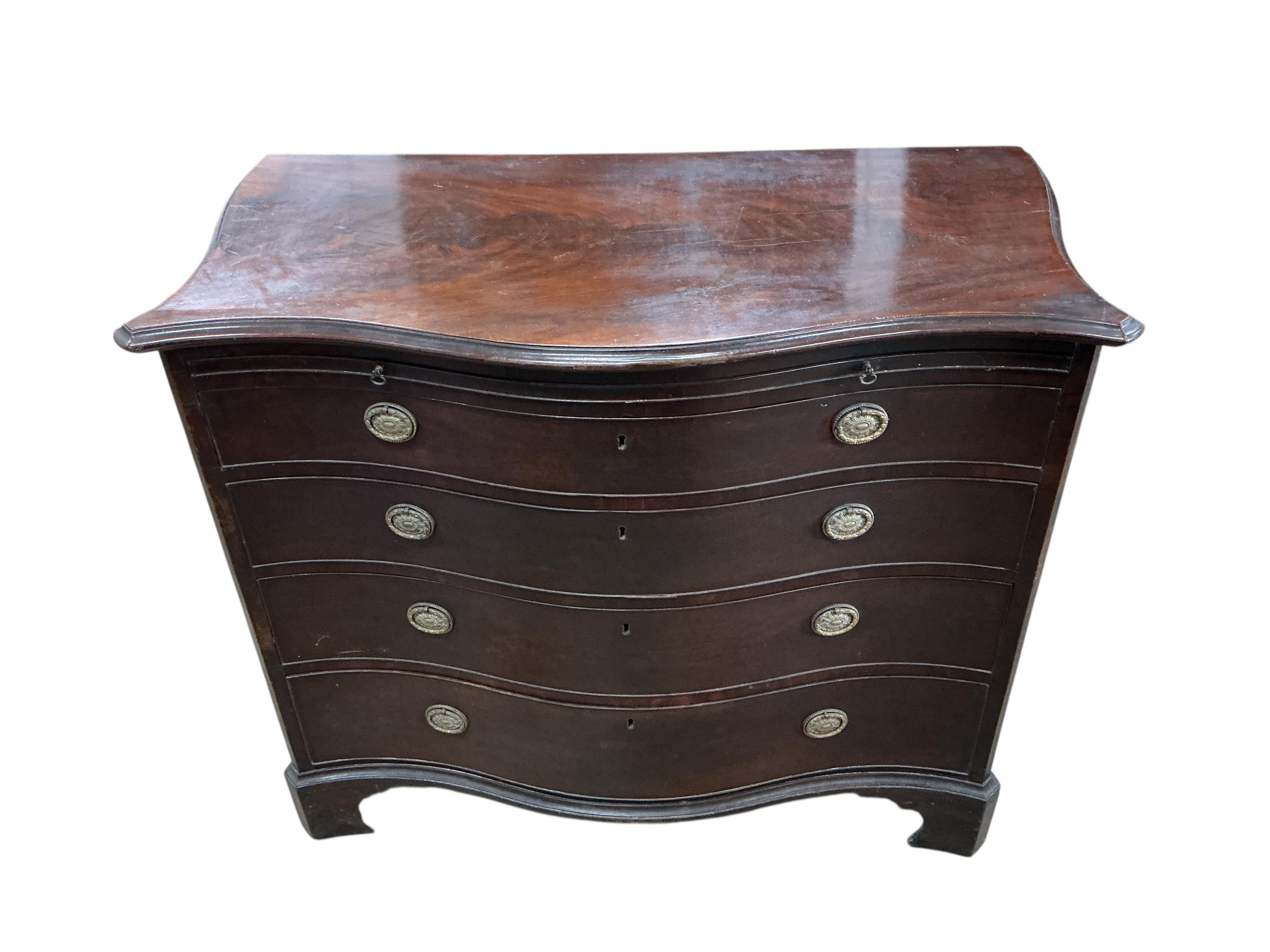 A George III mahogany serpentine chest, with brushing slide, width 111cm, depth 57cm, height 93cm